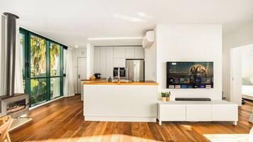 Apartment, Sea View | Living area | TV