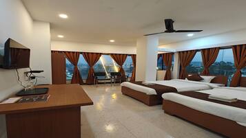 Premium bedding, desk, laptop workspace, blackout curtains