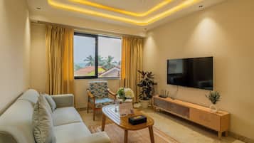 Apartment, 2 Bedrooms, Balcony, City View | Living area | Flat-screen TV