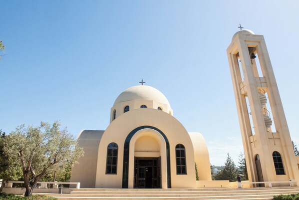 A church with a dome and a bell tower.