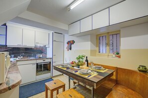 Family Apartment, Multiple Bedrooms, Mountainside (Casa Patrizia) | Private kitchen | Fridge, oven, stovetop, coffee/tea maker