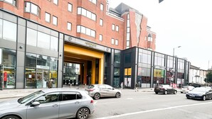 A modern building with a prominent 'ASSEMBLY' sign, large windows, and a yellow entrance. - Hammersmith 2 Bedroom Flat River Thames  (London)