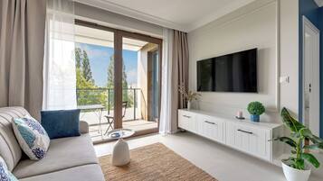 Deluxe appartement, uitzicht op stad | Woonkamer