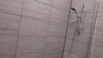 Shower, towels, toilet paper