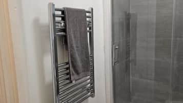 Shower, towels, soap, toilet paper