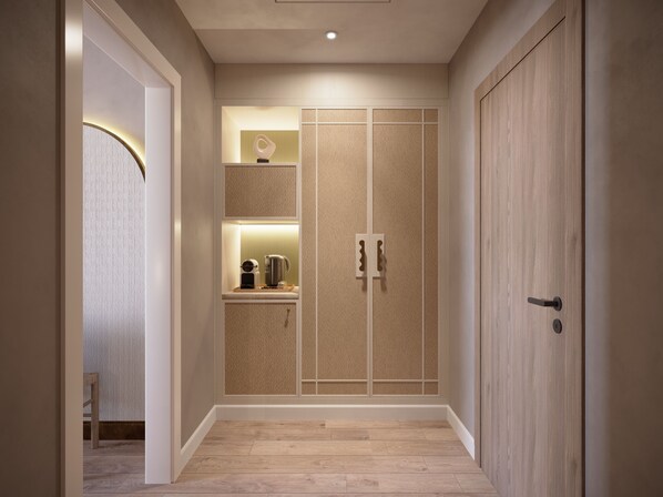 Enter a secure space with a wardrobe and kitchenette, offering a convenient stay.