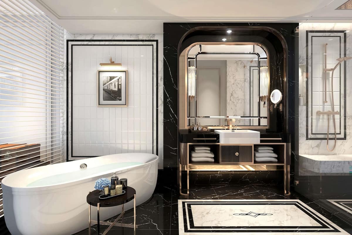 Un baño moderno con una bañera independiente, un tocador con un espejo grande y una zona de ducha.