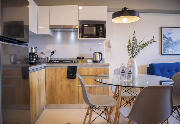 Fridge, microwave, stovetop, coffee/tea maker