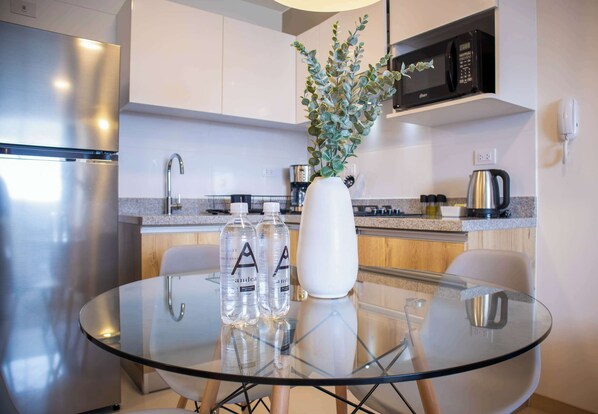 Fridge, microwave, stovetop, coffee/tea maker