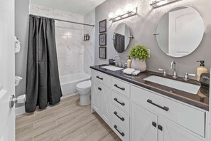 Shower, hair dryer, towels, shampoo