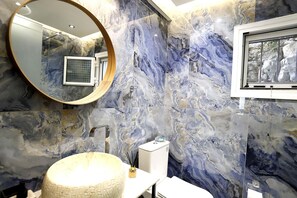 Shower, hair dryer, slippers, towels