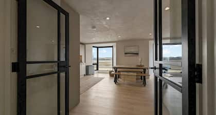 Beachfront eco-friendly apartment with ocean view and modern interior sleeping up to 6