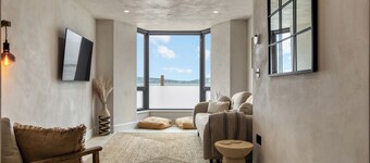 Beachfront eco-friendly apartment with ocean view and modern interior sleeping up to 6