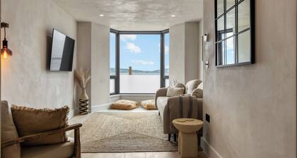 Beachfront eco-friendly apartment with ocean view and modern interior sleeping up to 6