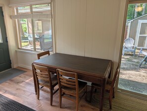 DINING ROOM:  The cabin has a cute dining table with seating for 4 adults. - The Higgins Lake Hideaway - Super Cute and Great Location Only 3 Blocks from Higgins Lake! (Roscommon)