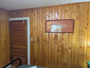 BEDROOM #1:  Includes a queen-size bed, nightstands, lamps, a dresser, and a mirror. - The Higgins Lake Hideaway - Super Cute and Great Location Only 3 Blocks from Higgins Lake! (Roscommon)