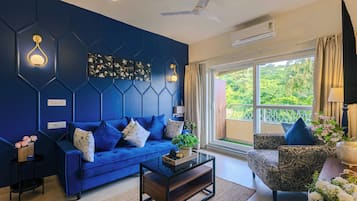 Deluxe Apartment, 1 Queen Bed, Balcony, Pool View | Living area | Flat-screen TV
