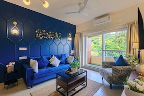 Deluxe Apartment, 1 Queen Bed, Balcony, Pool View | Living area | Flat-screen TV - Alaya Stays Veera Marina 1BHK with Pool (Candolim)