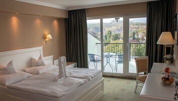 Deluxe Apartment, Pool View | In-room safe, desk, laptop workspace, blackout drapes