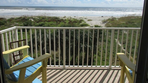 A balcony with a view of the beach and ocean. - Panoramic Oceanfront Condo | Balcony +Beach Access (Saint Augustine)
