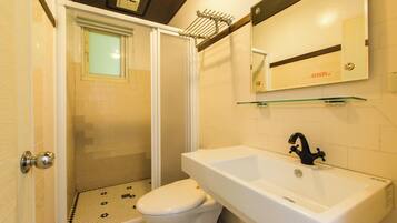 Shower, hair dryer, slippers, towels