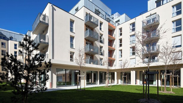A modern multi-story residential building with balconies, large windows, and a well-maintained lawn. - Quality Aparthotel Nancy Centre (Nancy)