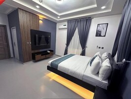 Family Room, Balcony, City View | Desk, laptop workspace, blackout drapes, soundproofing