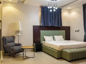 Family Room, Balcony, City View | Desk, laptop workspace, blackout drapes, soundproofing