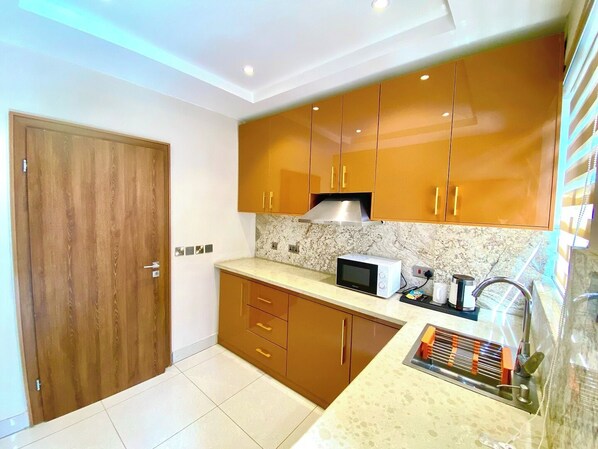 Economy Apartment, Balcony, City View | Private kitchen | Fridge, microwave, oven, stovetop