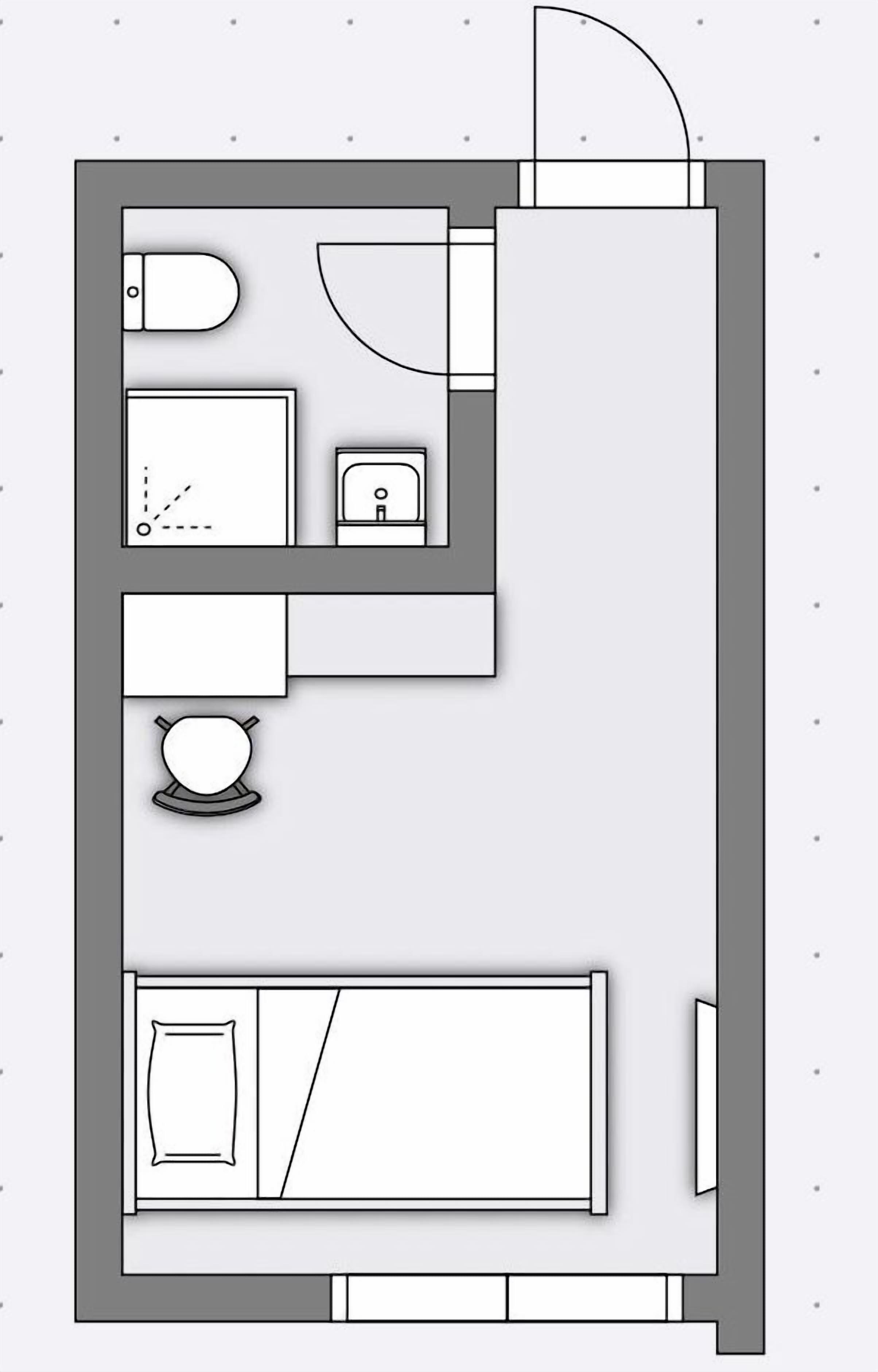 A floor plan of a hotel room with a bed, a desk, a chair, a small table, a toilet, and a sink.