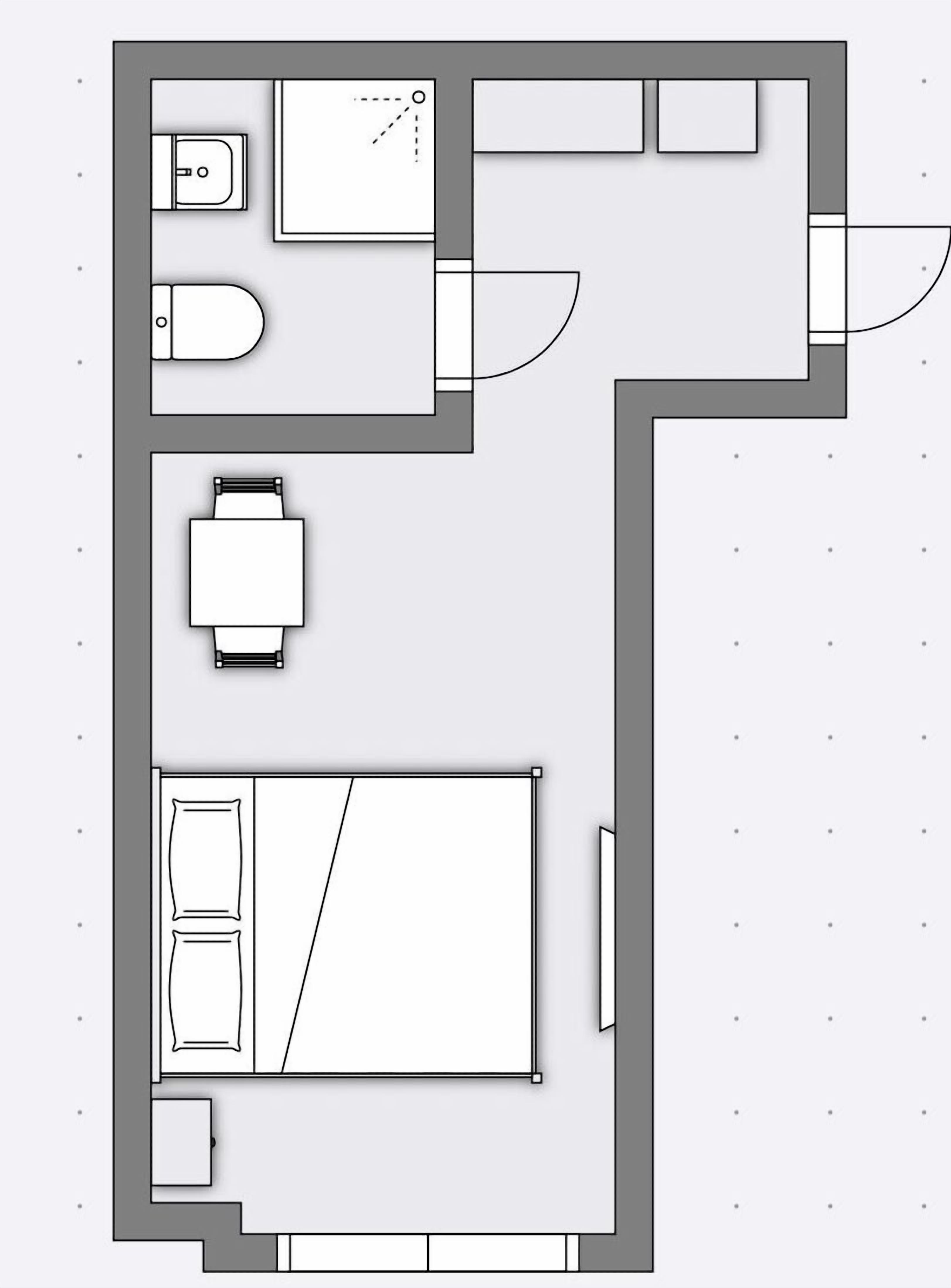 A floor plan with a bedroom, bathroom, and kitchenette.