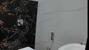 A bathroom with a toilet, bidet, and sink. - Hotel Regal (Saharanpur)