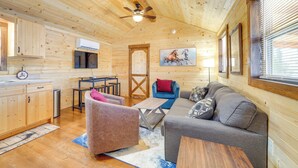 A wooden cabin interior with a kitchen, dining area, and living room. - 31 Mi to Louisville: Cabin on 235 Acres! (La Grange)