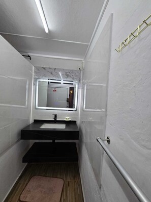 Shower, bidet, towels, soap