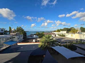 View from property - Charming 2-bedroom apartment in wonderful GrandBaie with seaview and with WiFiAC (Grand Baie)