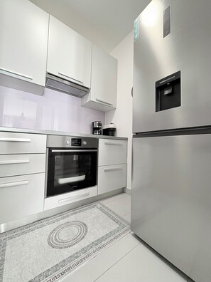 Deluxe Apartment, Balcony, City View | Private kitchen | Espresso maker, electric kettle, mixer, spices