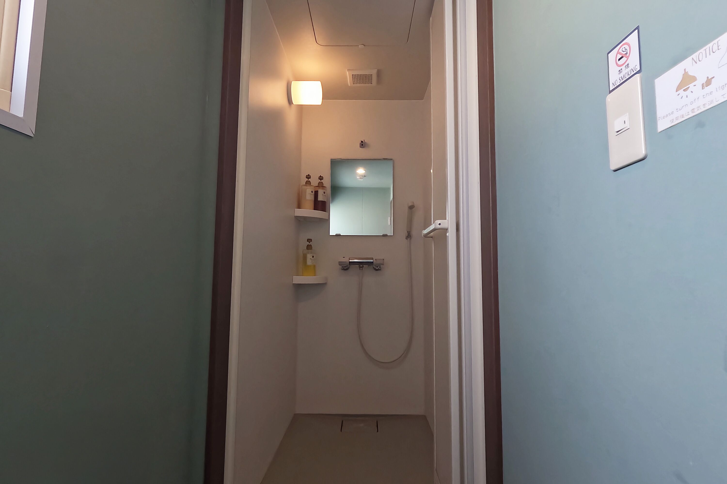 Shower, hair dryer, slippers, towels
