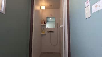 Shower, hair dryer, slippers, towels