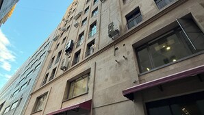 A multi-story building with large windows and air conditioning units. - 2-bedroom luxury apartment in the center of Yerevan by Sweet Home (Yerevan)