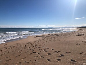 On the beach, sun-loungers, beach towels