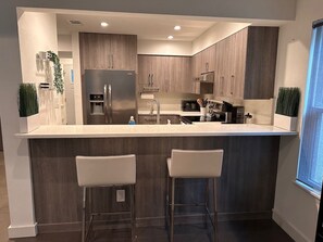 Microwave, dishwasher, cookware/dishes/utensils
