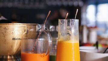 Two glass containers on a countertop, one with a metallic object labeled 'Bosch' and the other with a straw.