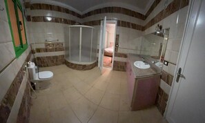 Shower, free toiletries, towels, toilet paper