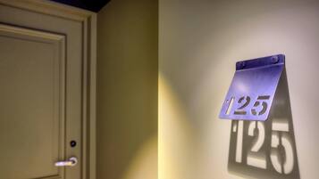 A door with a number sign indicating room 125.
