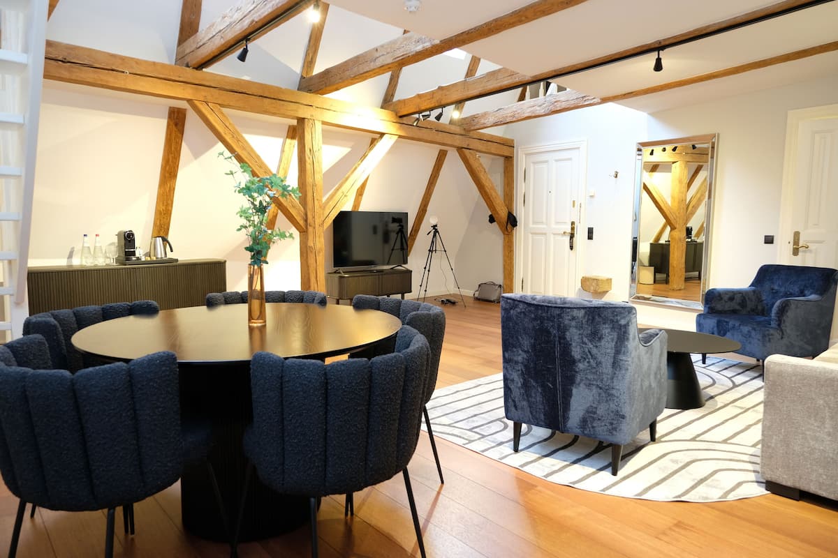 Senior Loft | Living area | 48-inch flat-screen TV with digital channels, books, heated floors