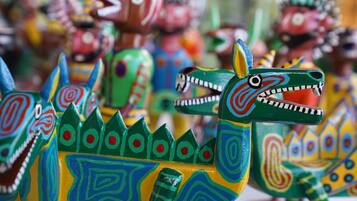 A collection of colorful, intricately painted wooden dragon figures.
