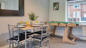 A dining area with a pool table, chairs, and a table set for two with plates and glasses. - Last Min Weekend Stay, Trafford, Pets Welcome (Sale)