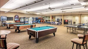A recreational area with pool tables, arcade games, and seating. - WorldMark Indio, 2 Bedroom/2 Bath Condo for Coachella (Indio)