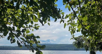 Lakeside Lodging, Elevated - Walk to Village shops and restaurants and enjoy a private lakefront, newly renovated and furnished 1843 home!