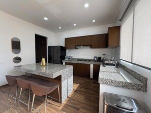 Fridge, microwave, stovetop, coffee/tea maker